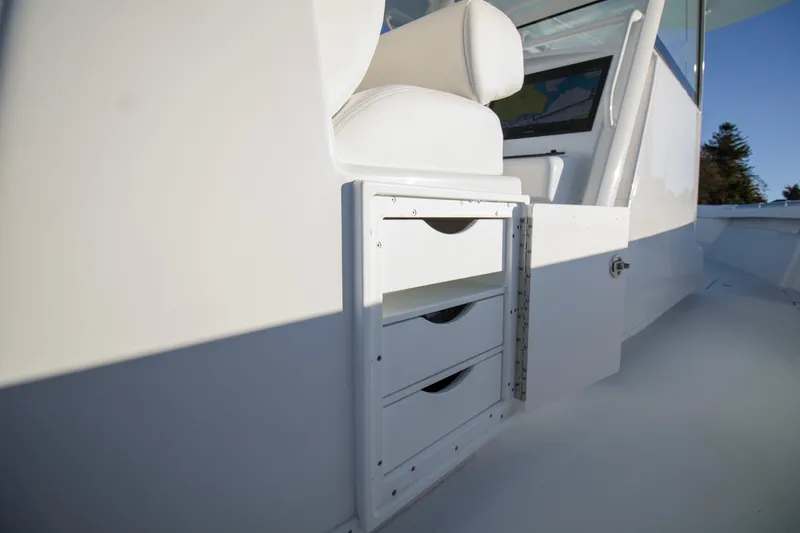 Slide: The Image of 2024 Yellowfin 39 boat interior with storage drawers and seating. - 17
