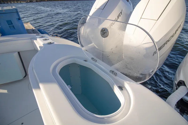 Slide: The Image of 2024 Yellowfin 39 boat with open livewell and dual Mercury engines. - 18