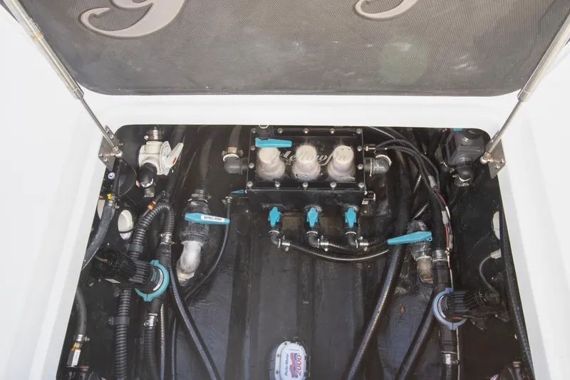Slide: The Image of 2024 Yellowfin 39 boat engine compartment with visible wiring and components. - 24