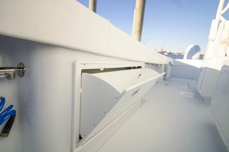Slide: The Image of 2024 Yellowfin 39 boat deck with open storage compartment. - 37