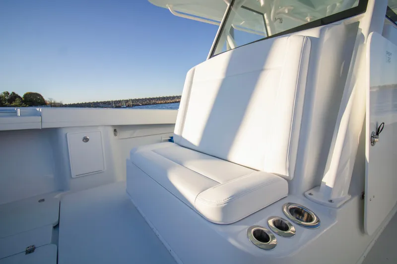 Slide: The Image of 2024 Yellowfin 39 boat interior with white seating and cup holders. - 38