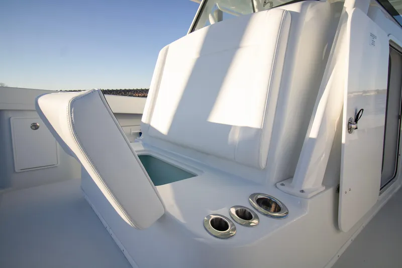 Slide: The Image of 2024 Yellowfin 39 boat interior with sleek white seating and cup holders. - 39