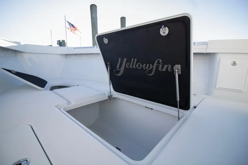 Slide: The Image of 2024 Yellowfin 39 boat storage compartment open on deck. - 43