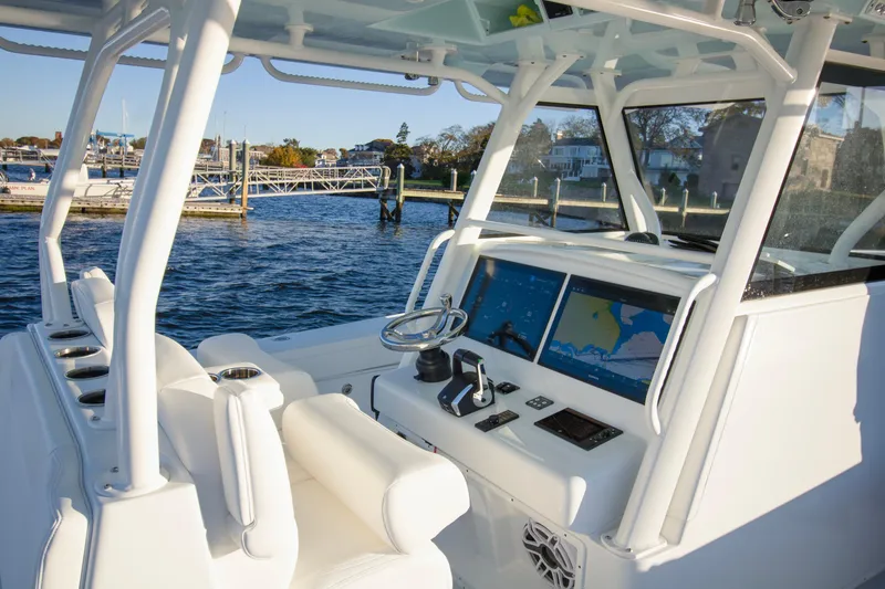 Slide: The Image of 2024 Yellowfin 39 boat interior with advanced navigation system and waterfront view. - 46