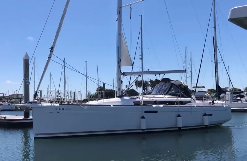 Slide: The Image of 2020 Jeanneau Sun Odyssey 389 sailboat docked in marina. - 1