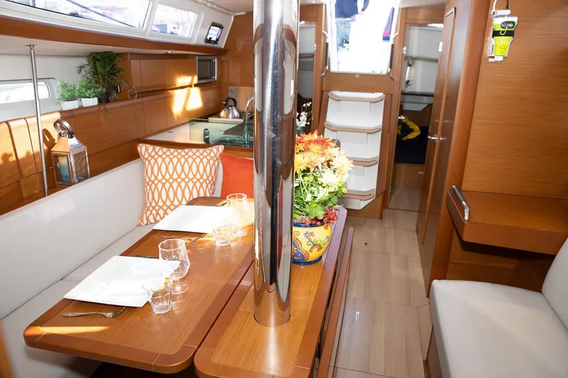 Slide: The Image of Interior of 2020 Jeanneau Sun Odyssey 389 sailboat with dining area and modern decor. - 10