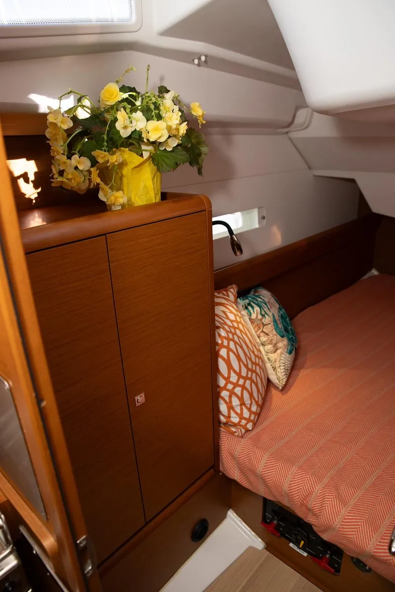 Slide: The Image of Cozy cabin interior of 2020 Jeanneau Sun Odyssey 389 with floral decor and cushions. - 13
