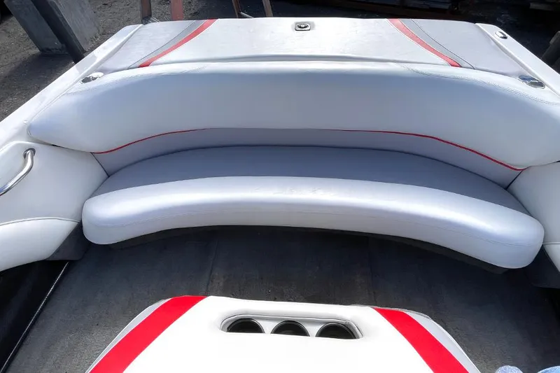 Slide: The Image of 1999 Malibu Response LX boat interior with white and red seating. - 12