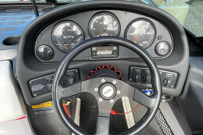 Slide: The Image of 1999 Malibu Response LX dashboard with steering wheel and gauges. - 7