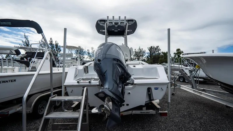 Slide: The Image of 2025 Tidewater 220 CC Adventure boat with outboard motor, displayed in a marina. - 4