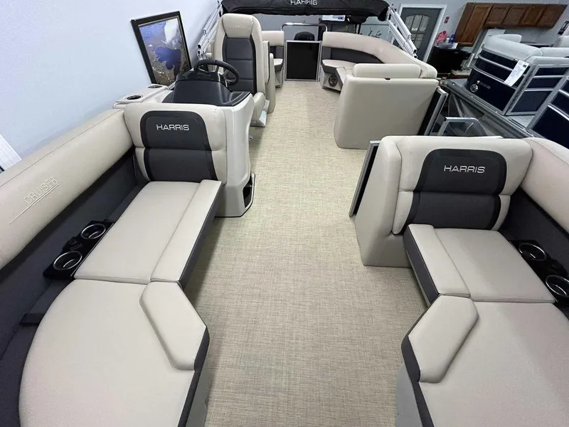 Slide: The Image of 2025 Harris Cruiser 210 boat interior with spacious seating and modern design. - 9
