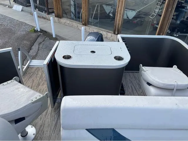 Slide: The Image of 2023 SunCatcher Select 16F boat interior with seating and storage compartments. - 10