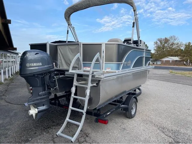 Slide: The Image of 2023 SunCatcher Select 16F pontoon boat with Yamaha motor and trailer. - 5