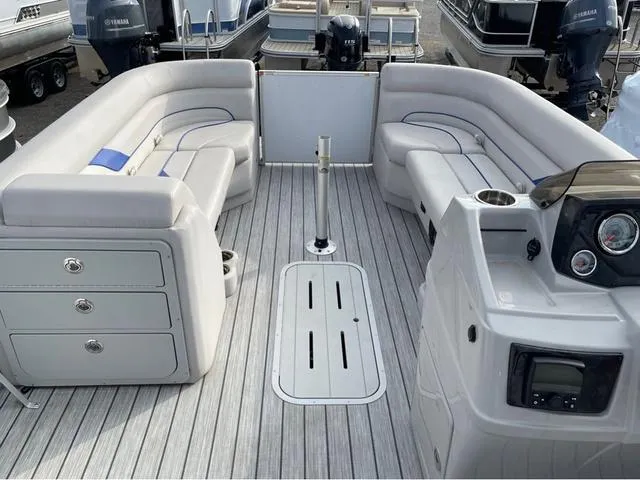 Slide: The Image of 2023 SunCatcher Select 324RC pontoon boat interior with plush seating and modern dashboard. - 10