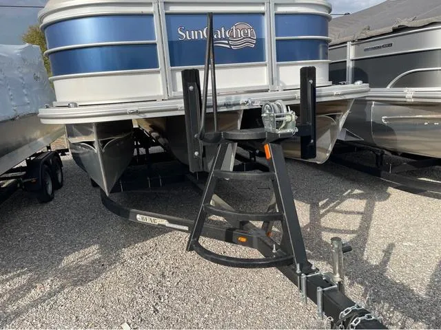 Slide: The Image of 2023 SunCatcher Select 324RC pontoon boat on trailer, front view. - 3