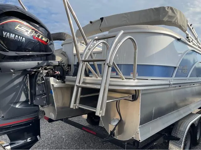 Slide: The Image of 2023 SunCatcher Select 324RC pontoon boat with Yamaha engine and stainless steel ladder. - 4