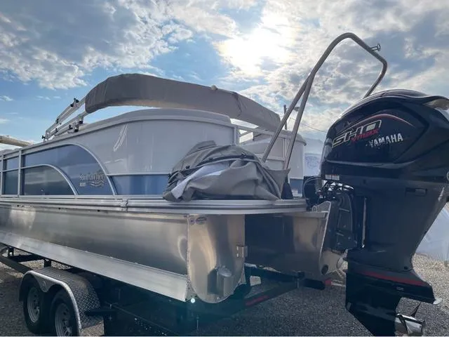 Slide: The Image of 2023 SunCatcher Select 324RC pontoon boat with Yamaha motor on trailer under cloudy sky. - 5