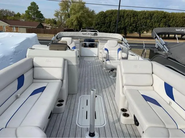 Slide: The Image of 2023 SunCatcher Select 324RC pontoon boat with spacious seating and modern design. - 6