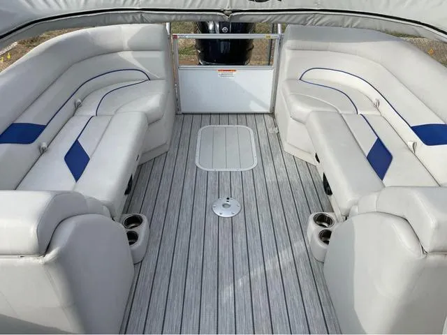 Slide: The Image of 2023 SunCatcher Select 324RC boat interior with plush seating and modern design. - 7