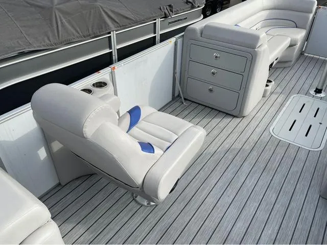 Slide: The Image of Luxurious seating on 2023 SunCatcher Select 324RC pontoon boat with sleek gray flooring. - 8