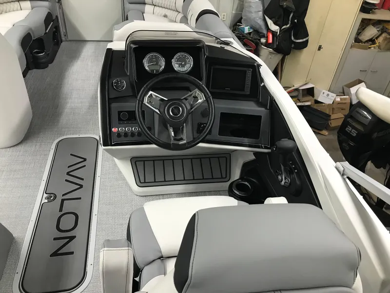 Slide: The Image of 2025 Avalon Catalina boat interior with modern steering console and comfortable seating. - 13