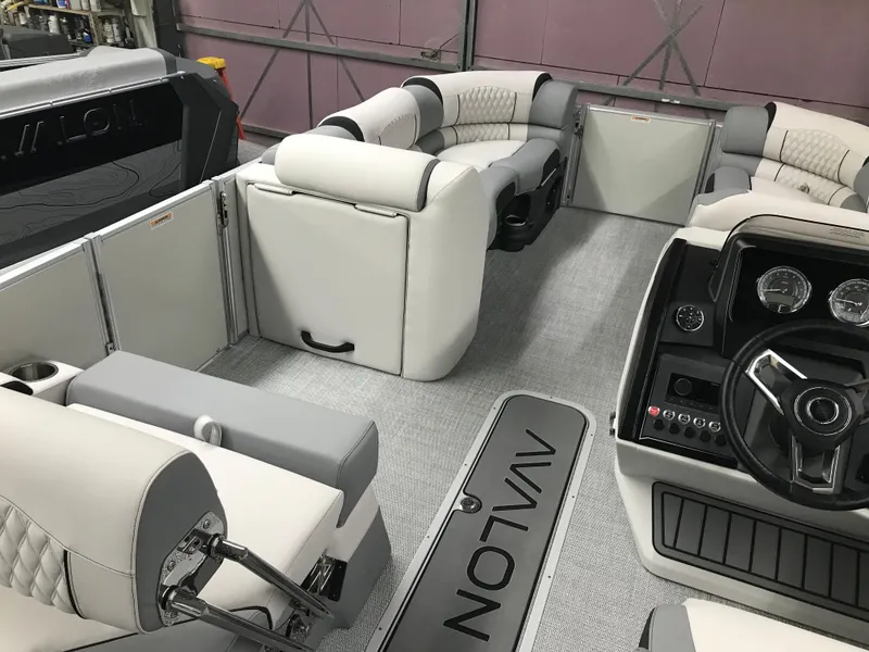 Slide: The Image of 2025 Avalon Catalina boat interior with luxurious seating and modern dashboard. - 14
