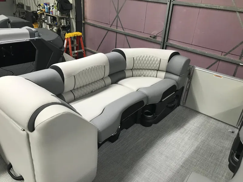 Slide: The Image of 2025 Avalon Catalina boat interior with plush seating and modern design. - 15