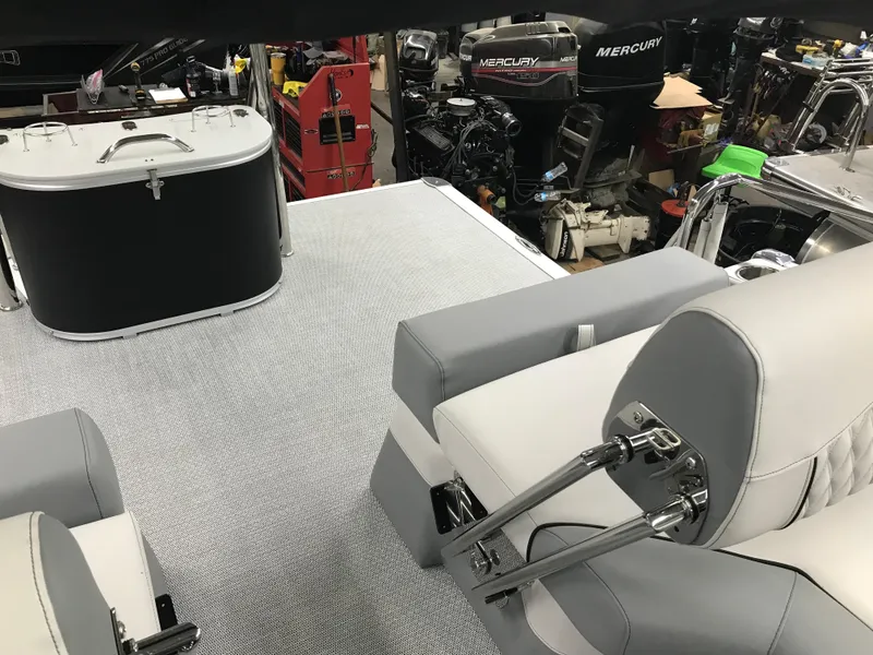 Slide: The Image of 2025 Avalon Catalina boat interior with modern seating and equipment in a workshop setting. - 23