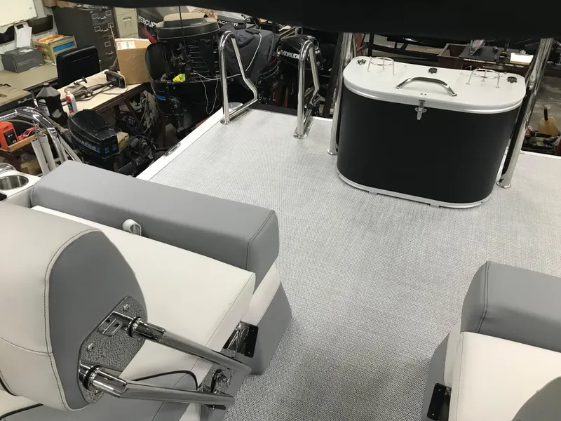 Slide: The Image of 2025 Avalon Catalina boat interior with gray seating and sleek design. - 24