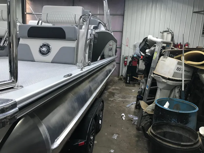 Slide: The Image of 2025 Avalon Catalina pontoon boat in a workshop setting. - 7