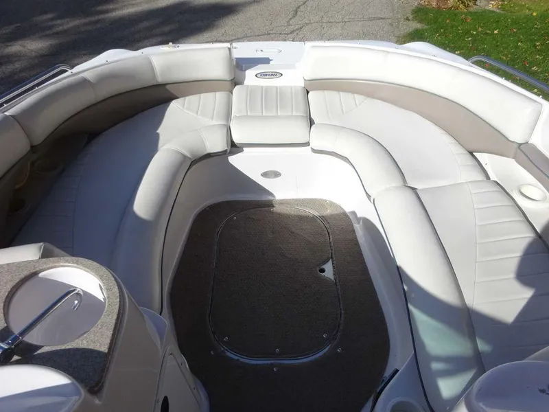 Slide: The Image of 2002 Four Winns 234 Funship boat interior with spacious seating and carpeted floor. - 11