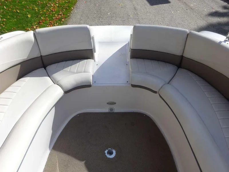 Slide: The Image of 2002 Four Winns 234 Funship boat interior with cushioned seating. - 15