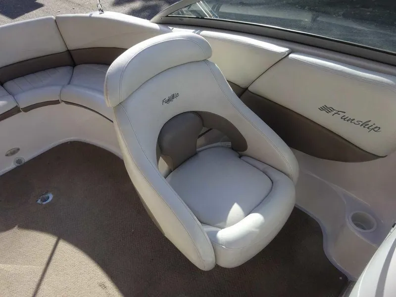 Slide: The Image of 2002 Four Winns 234 Funship boat interior with plush seating. - 16