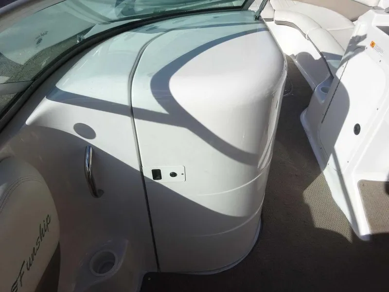 Slide: The Image of Interior view of 2002 Four Winns 234 Funship boat, featuring seating and storage areas. - 21