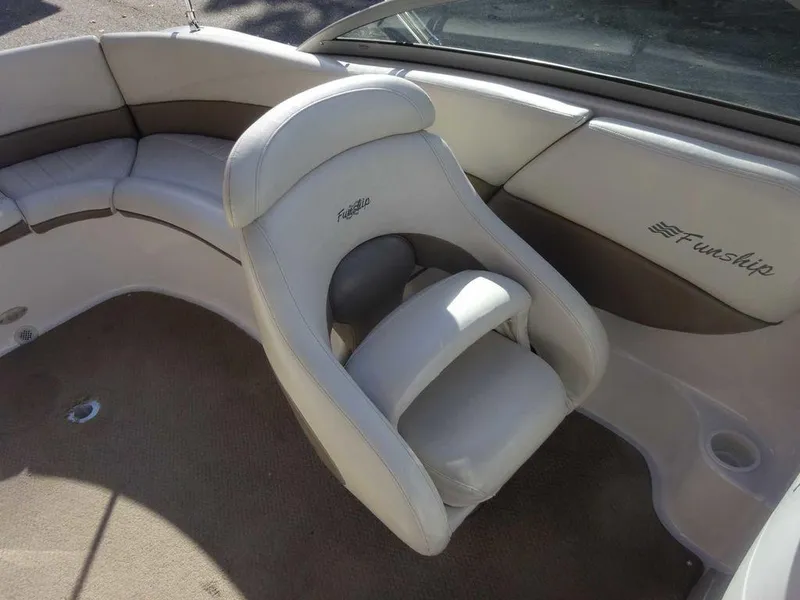 Slide: The Image of 2002 Four Winns 234 Funship boat interior with beige seating and carpet. - 23