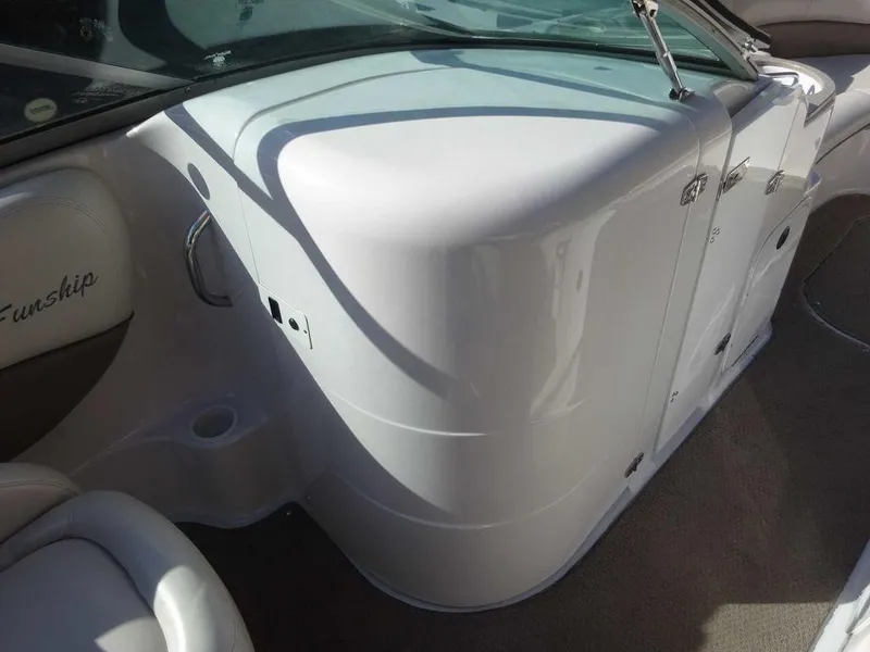 Slide: The Image of 2002 Four Winns 234 Funship boat interior with sleek white design. - 7