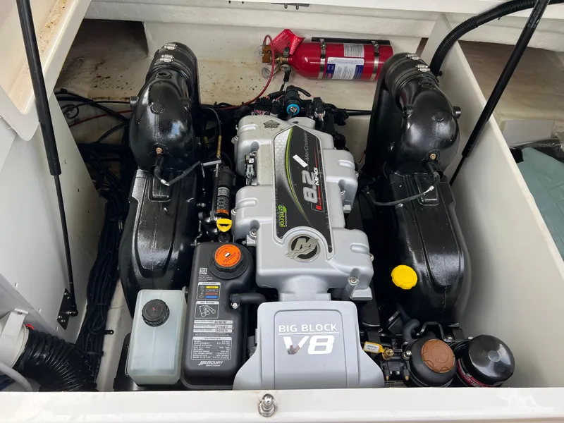 Slide: The Image of 2022 Sea Ray SDX 290 engine compartment with Big Block V8 engine. - 10