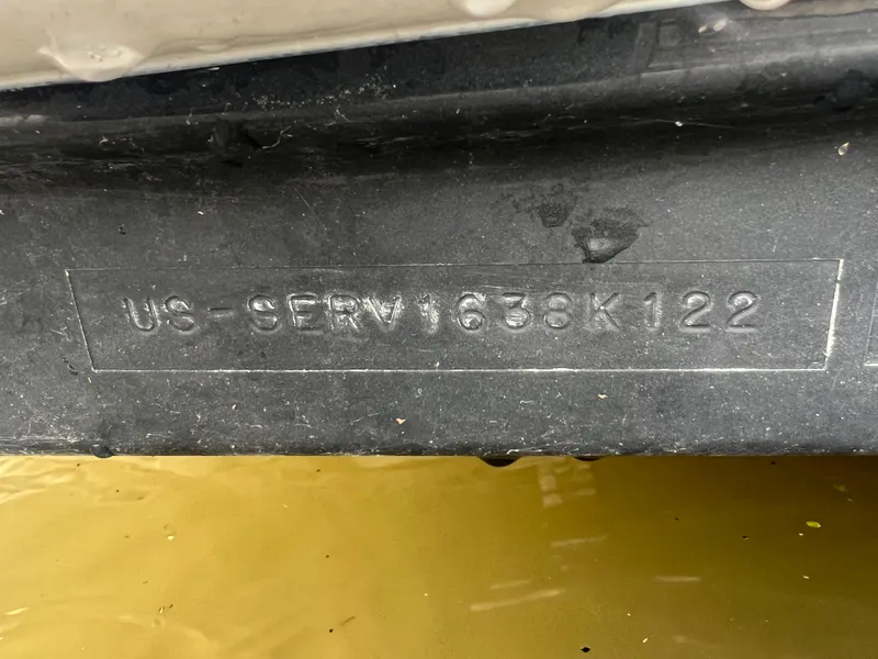 Slide: The Image of 2022 Sea Ray SDX 290 hull identification number on black surface. - 14