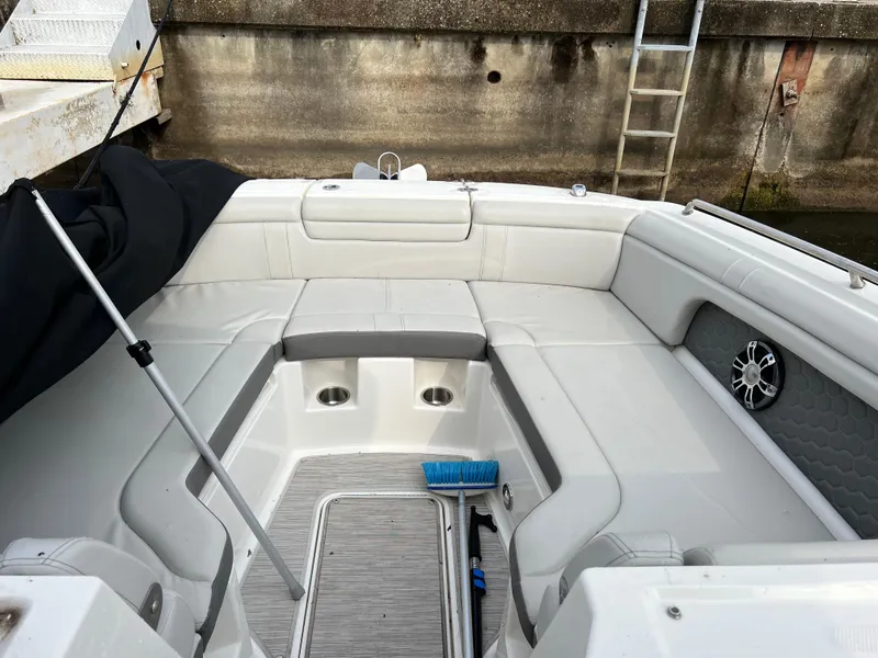 Slide: The Image of 2022 Sea Ray SDX 290 boat interior with white seating and speaker. - 5
