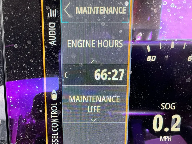 Slide: The Image of Dashboard display of 2022 Sea Ray SDX 290 showing 66:27 engine hours. - 8