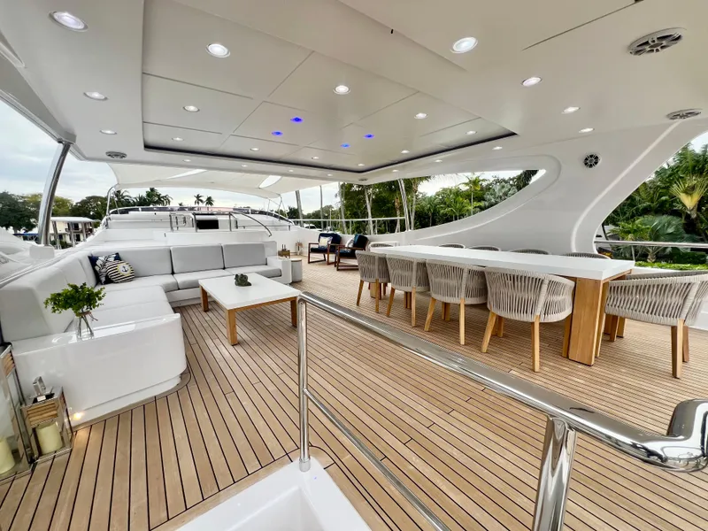 Slide: The Image of Luxurious 2011 Mengi Yay 115 MY yacht deck with elegant seating and dining area. - 21
