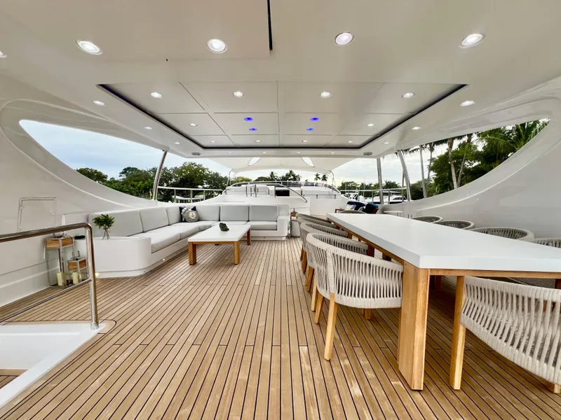 Slide: The Image of Luxurious 2011 Mengi Yay 115 MY yacht deck with elegant seating and dining area. - 22