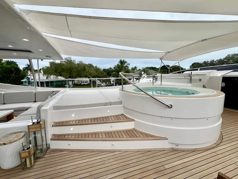 Slide: The Image of Luxurious 2011 Mengi Yay 115 MY yacht deck with jacuzzi and seating area. - 28