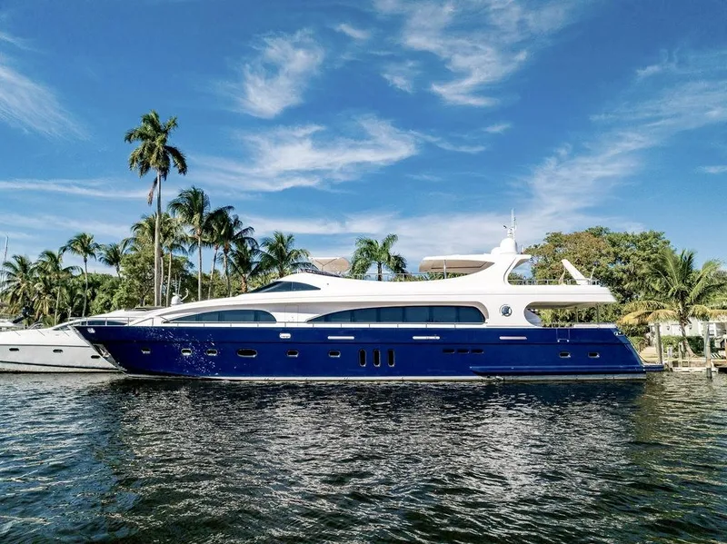 Slide: The Image of Luxurious 2011 Mengi Yay 115 MY yacht docked by palm trees under a clear blue sky. - 5