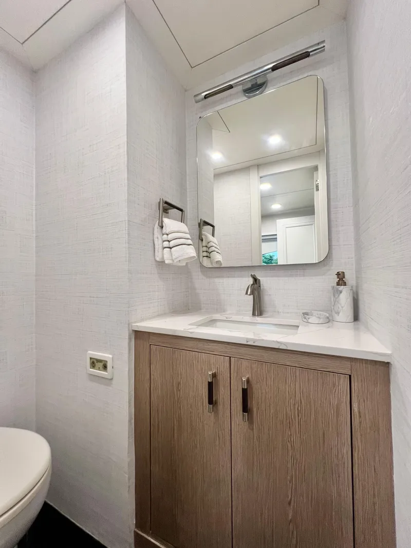 Slide: The Image of Luxurious bathroom on 2011 Mengi Yay 115 MY yacht with modern fixtures and wooden cabinetry. - 59
