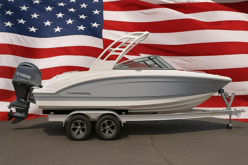 The Image of 2025 Chaparral 23 SSi OB boat on trailer, American flag background. - 0
