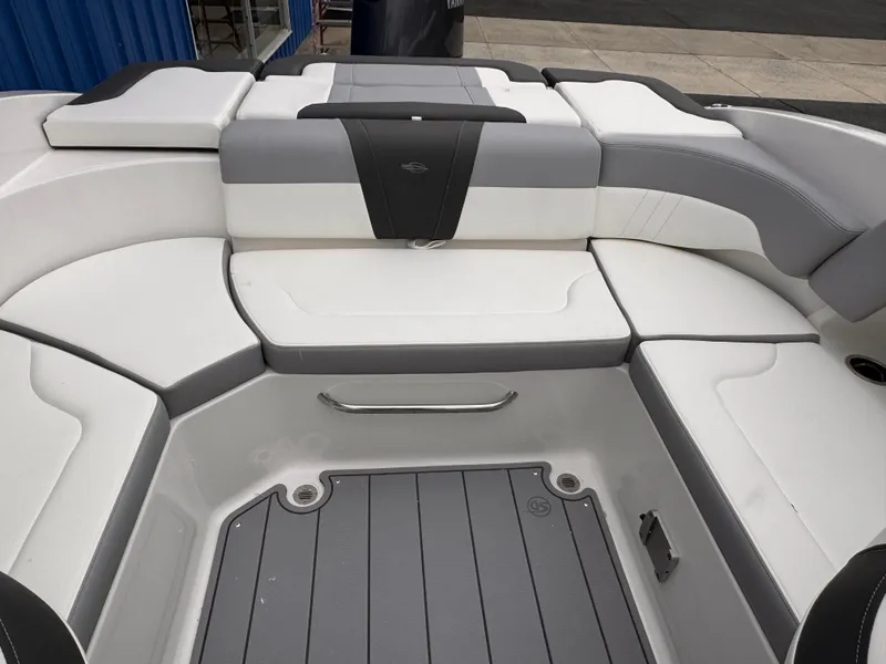 Slide: The Image of 2025 Chaparral 23 SSi OB boat interior with gray and white seating. - 17