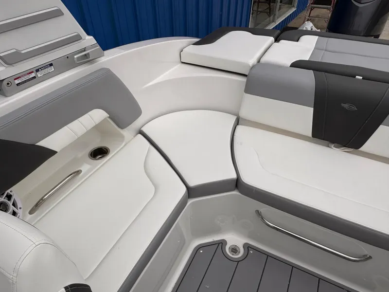 Slide: The Image of 2025 Chaparral 23 SSi OB boat interior with sleek white and gray seating. - 21