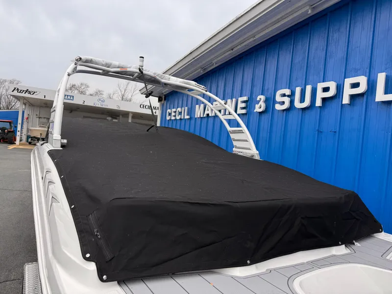 Slide: The Image of 2025 Chaparral 23 SSi OB boat with cover at marine supply store. - 42