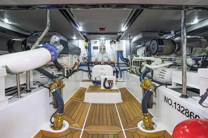 Slide: The Image of Engine room of 2025 Eastbay EB60 yacht with advanced machinery and wooden flooring. - 28